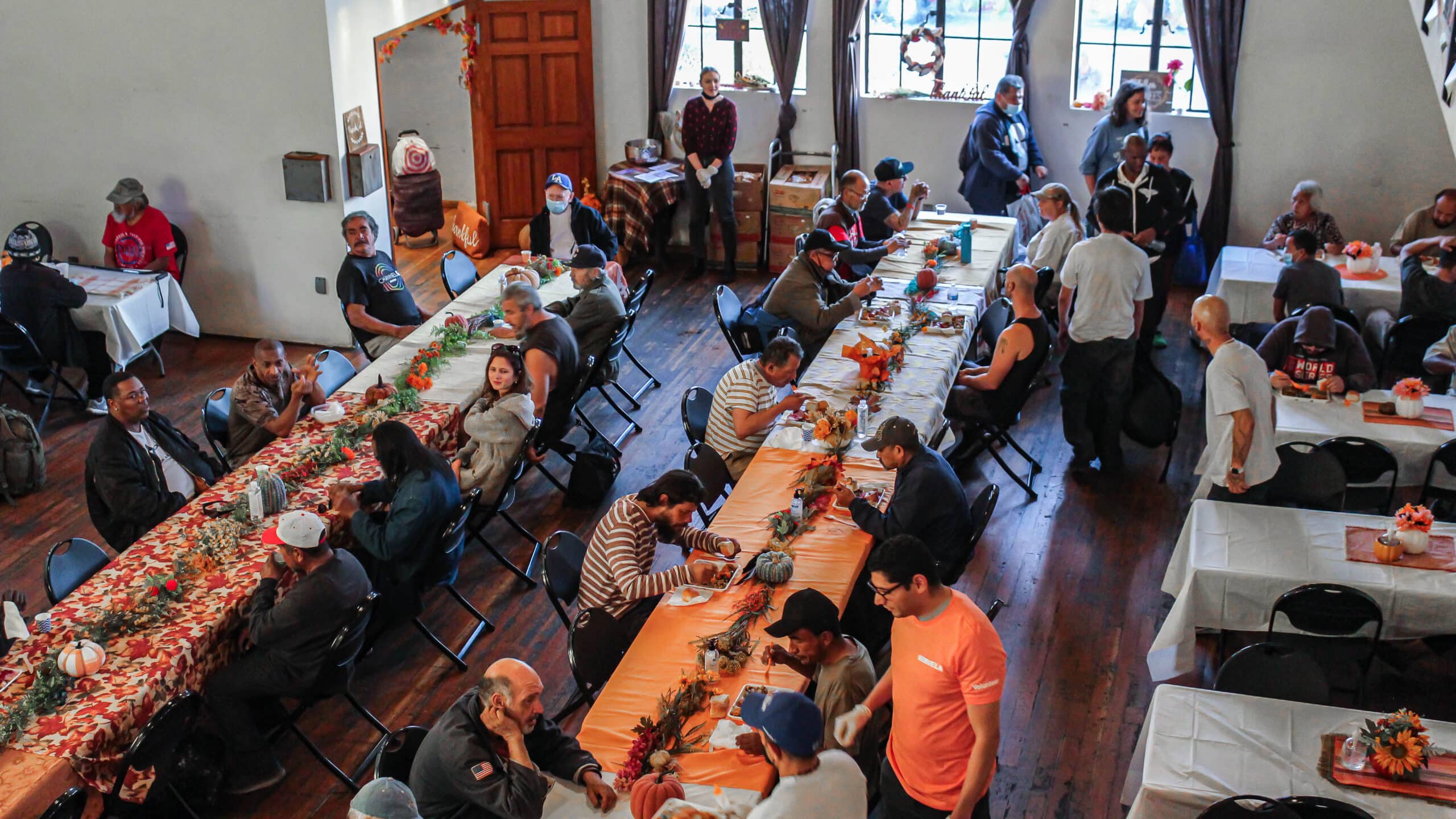 A group of people eating at a long table.