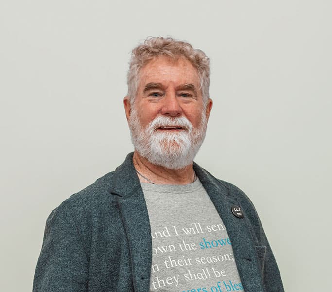 A man with a beard wearing a t-shirt.